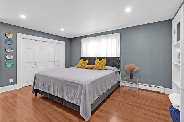 15 Smith St, Danbury, CT 06810 - bedroom featuring baseboards, recessed lighting, wood finished floors, a closet, and a baseboard radiator