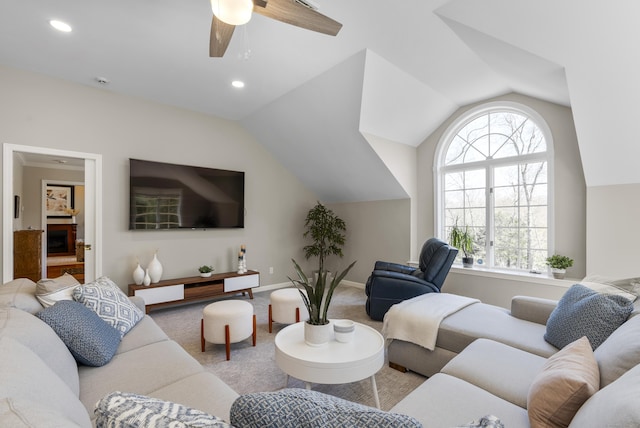 living area with lofted ceiling, baseboards, recessed lighting, a ceiling fan, and carpet