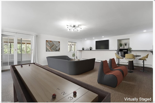 rec room with recessed lighting, plenty of natural light, baseboard heating, and carpet