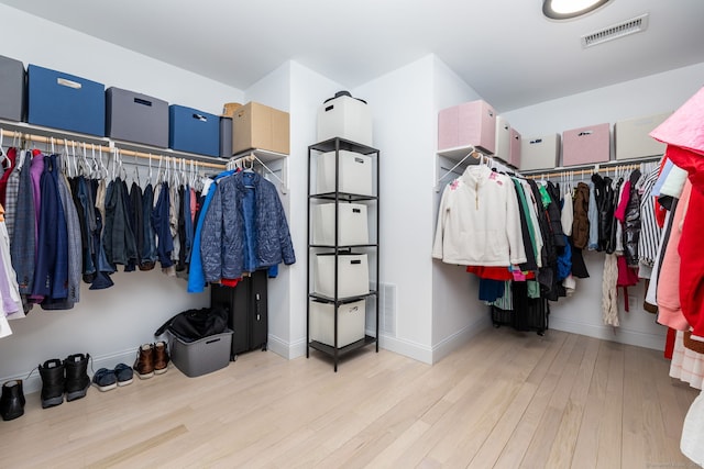walk in closet featuring visible vents and light wood-type flooring