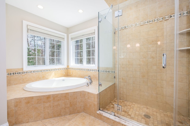 full bathroom featuring a stall shower, a garden tub, tile patterned flooring, and recessed lighting