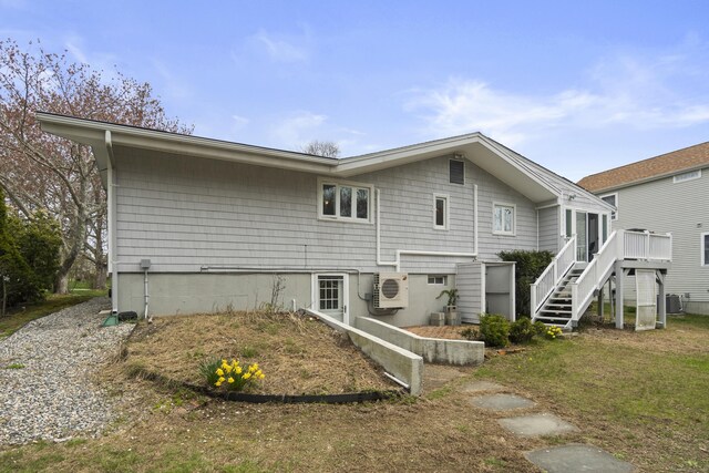 33 Cottage Ln, East Lyme, CT 06357 - back of property with central air condition unit, stairs, ac unit, and a deck