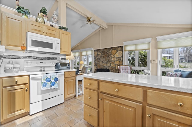 33 Cottage Ln, East Lyme, CT 06357 - kitchen with plenty of natural light, light countertops, lofted ceiling with beams, and white appliances