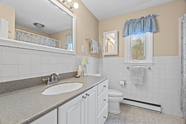 33 Cottage Ln, East Lyme, CT 06357 - full bathroom with wainscoting, vanity, toilet, tile walls, and a baseboard heating unit