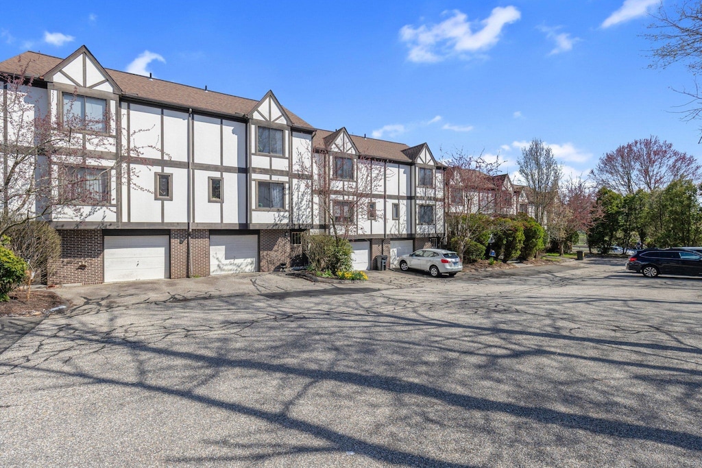 204 New Haven Ave Unit 8F, Derby, CT 06418 - view of building exterior featuring a residential view and an attached garage