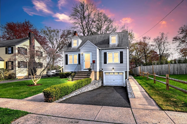 cape cod-style house with asphalt driveway, a garage, and a chimney