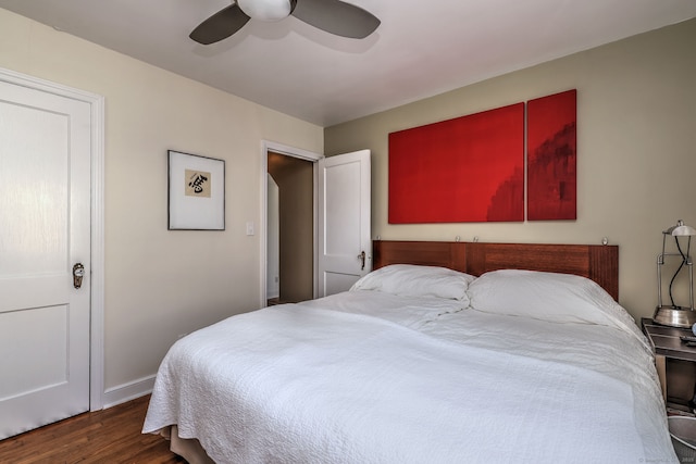bedroom with wood finished floors, baseboards, and ceiling fan