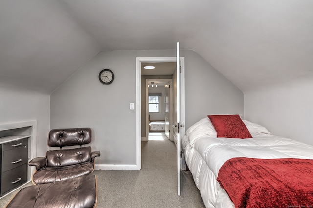 carpeted bedroom featuring vaulted ceiling