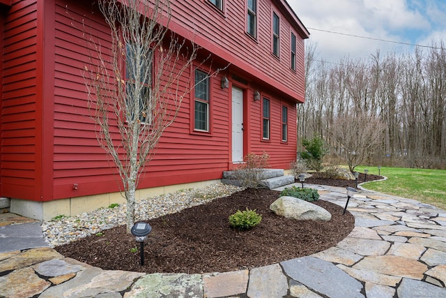 view of side of home with entry steps