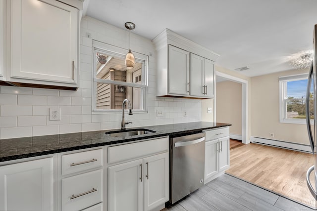 120 Newton St, Berlin, CT 06037 - kitchen featuring baseboard heating, dark stone counters, stainless steel dishwasher, tasteful backsplash, and a sink