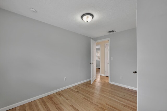 120 Newton St, Berlin, CT 06037 - spare room featuring baseboards, visible vents, a textured ceiling, and light wood-style floors