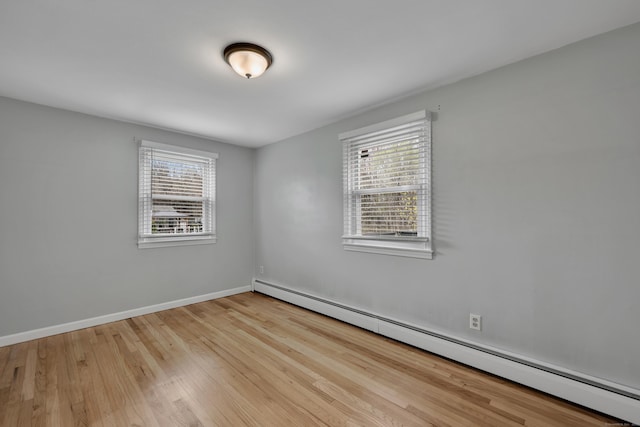 120 Newton St, Berlin, CT 06037 - unfurnished room featuring baseboards, baseboard heating, and wood finished floors