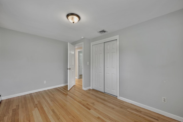 120 Newton St, Berlin, CT 06037 - unfurnished bedroom featuring baseboards, light wood finished floors, visible vents, and a closet