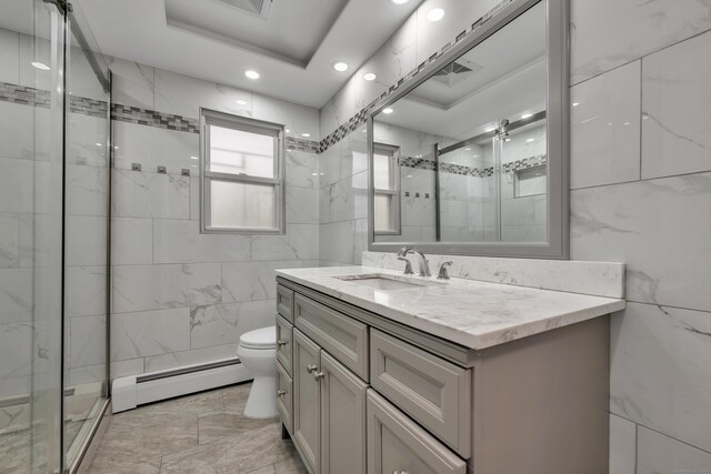 120 Newton St, Berlin, CT 06037 - full bath with toilet, tile walls, a stall shower, baseboard heating, and vanity