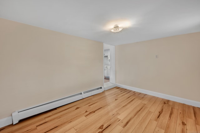 120 Newton St, Berlin, CT 06037 - spare room with baseboards, baseboard heating, and wood finished floors