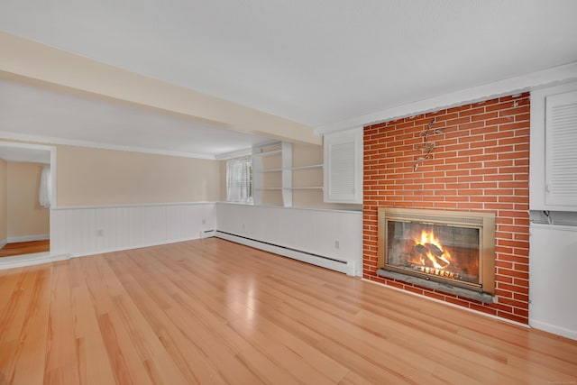 120 Newton St, Berlin, CT 06037 - unfurnished living room featuring wainscoting, baseboard heating, wood finished floors, and a brick fireplace