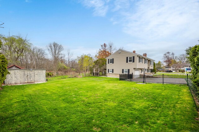 120 Newton St, Berlin, CT 06037 - view of yard with an attached garage, stairs, and fence