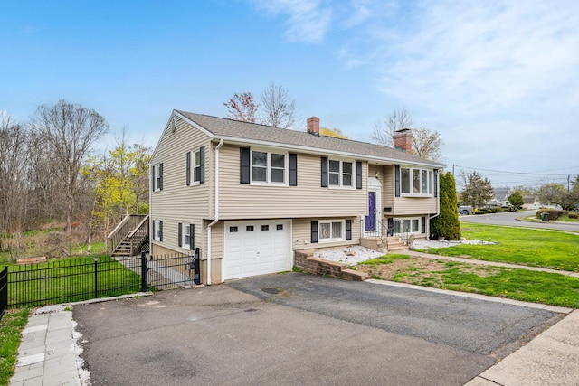 120 Newton St, Berlin, CT 06037 - bi-level home with a front yard, a chimney, aphalt driveway, and fence