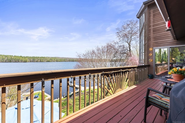 deck featuring a water view