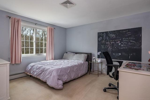 carpeted bedroom with baseboard heating and visible vents