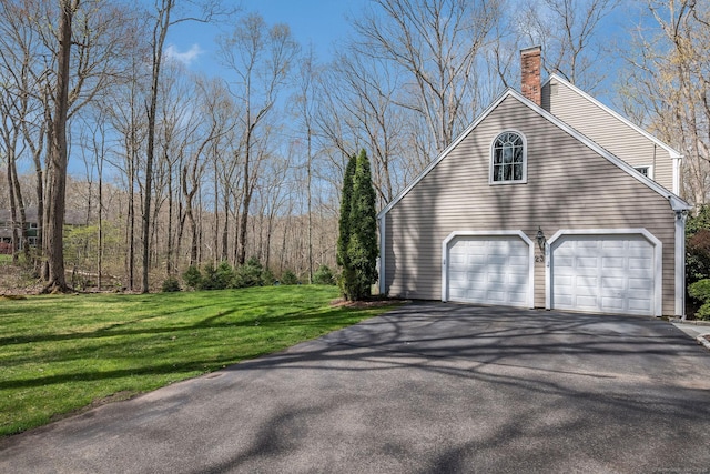 garage featuring aphalt driveway