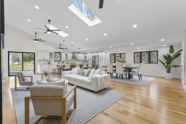 35 Bayberry Ln, Guilford, CT 06437 - living area with light wood finished floors, a wealth of natural light, recessed lighting, and ceiling fan