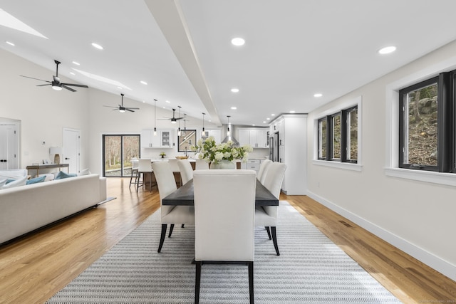 35 Bayberry Ln, Guilford, CT 06437 - dining room featuring recessed lighting, a ceiling fan, lofted ceiling with skylight, light wood-type flooring, and baseboards