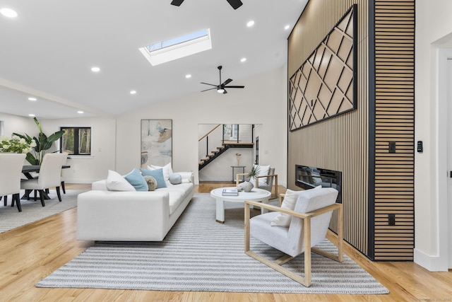 35 Bayberry Ln, Guilford, CT 06437 - living room featuring stairway, a ceiling fan, wood finished floors, a skylight, and recessed lighting