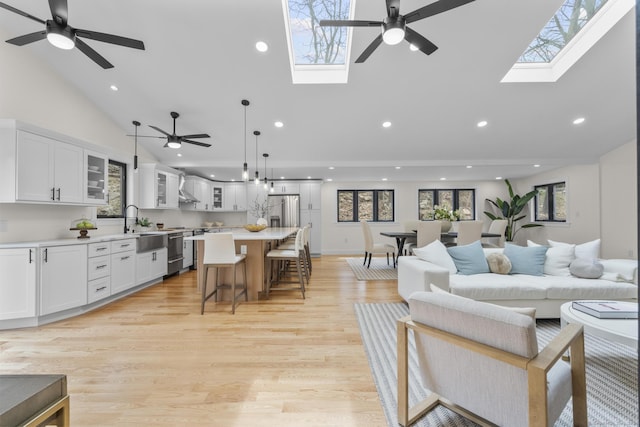 35 Bayberry Ln, Guilford, CT 06437 - living area featuring recessed lighting, a skylight, high vaulted ceiling, and ceiling fan