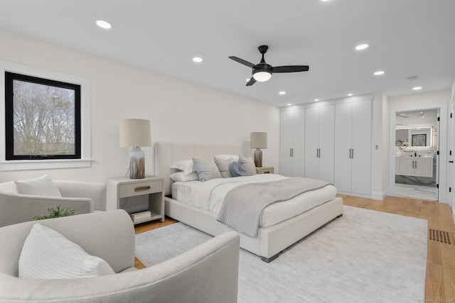 35 Bayberry Ln, Guilford, CT 06437 - bedroom featuring light wood-type flooring, ensuite bathroom, recessed lighting, and ceiling fan