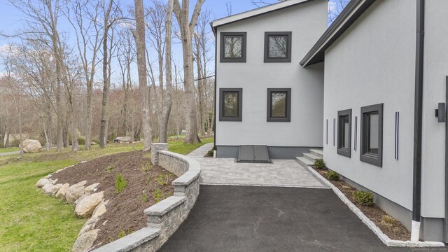 35 Bayberry Ln, Guilford, CT 06437 - exterior space with stucco siding