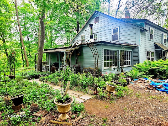 12 Wells Rd, New Milford, CT 06776 - view of front of property featuring a chimney and a porch
