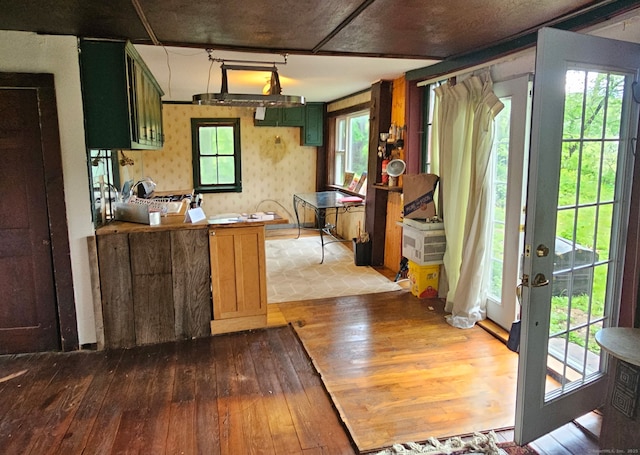 12 Wells Rd, New Milford, CT 06776 - kitchen with dark wood-style floors, wallpapered walls, and a peninsula