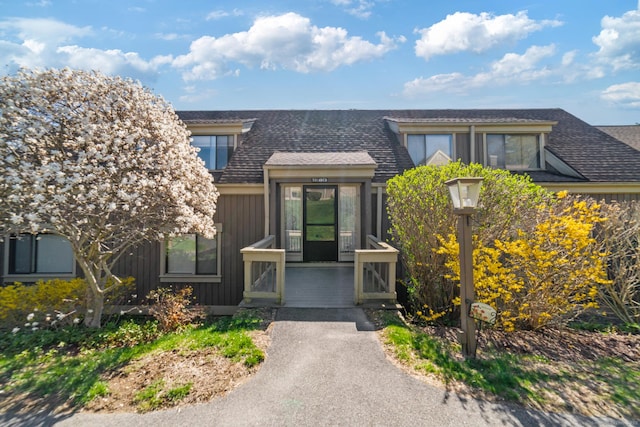 231 Heritage Vlg Unit C, Southbury, CT 06488 - property entrance with board and batten siding and roof with shingles