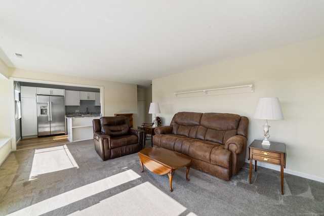 231 Heritage Vlg Unit C, Southbury, CT 06488 - living room featuring light carpet and baseboards
