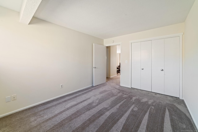 231 Heritage Vlg Unit C, Southbury, CT 06488 - unfurnished bedroom with carpet flooring and a closet