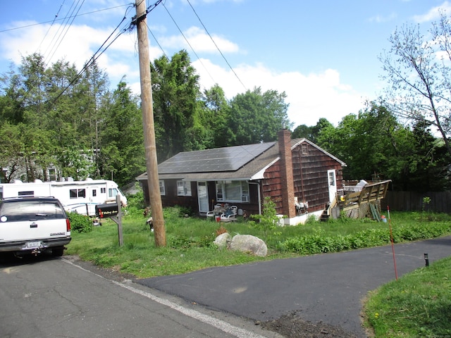 37 Foley Ave, Shelton, CT 06484 - view of front facade with solar panels and a chimney