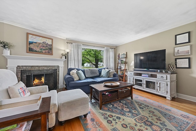 447 Howellton Rd, Orange, CT 06477 - living area with crown molding, wood finished floors, and a lit fireplace