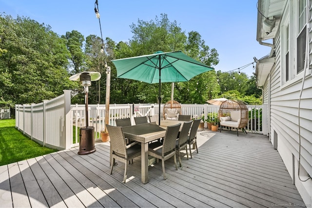 447 Howellton Rd, Orange, CT 06477 - wooden deck with outdoor dining area and view of wooded area