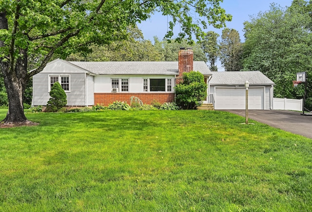 447 Howellton Rd, Orange, CT 06477 - view of front of house with a chimney, asphalt driveway, and a garage