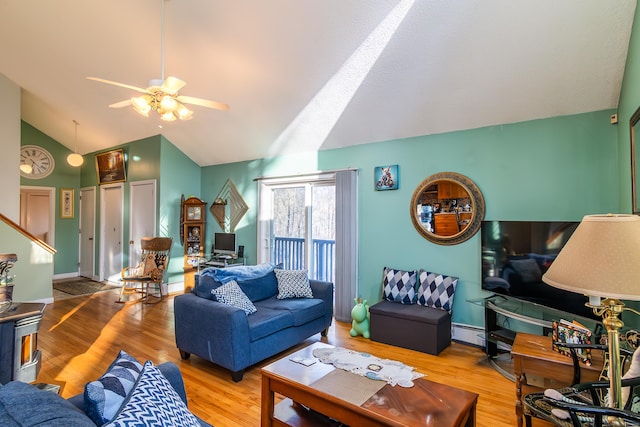 259 Weatherly Trl, Guilford, CT 06437 - living area featuring vaulted ceiling, baseboard heating, wood finished floors, stairway, and ceiling fan