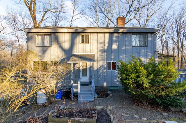 259 Weatherly Trl, Guilford, CT 06437 - view of front facade with a chimney and a garden