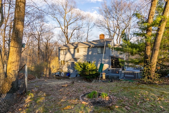 259 Weatherly Trl, Guilford, CT 06437 - rear view of house with a wooden deck and a chimney