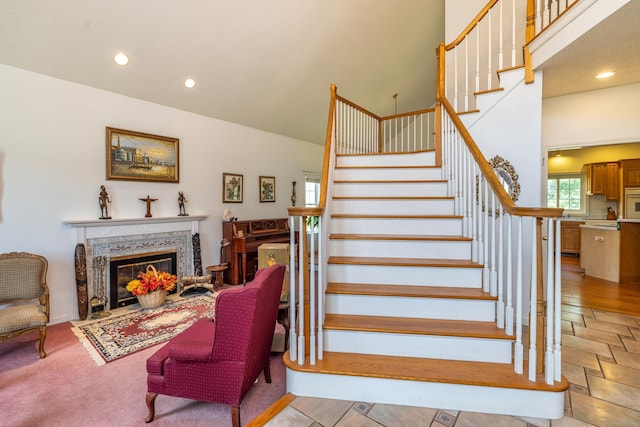 14 Fieldstone Dr, Mansfield, CT 06268 - stairs featuring a high end fireplace and recessed lighting