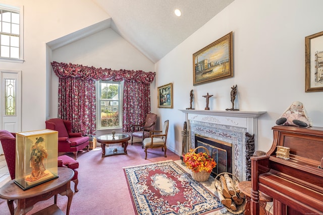 14 Fieldstone Dr, Mansfield, CT 06268 - carpeted living room with a glass covered fireplace and high vaulted ceiling
