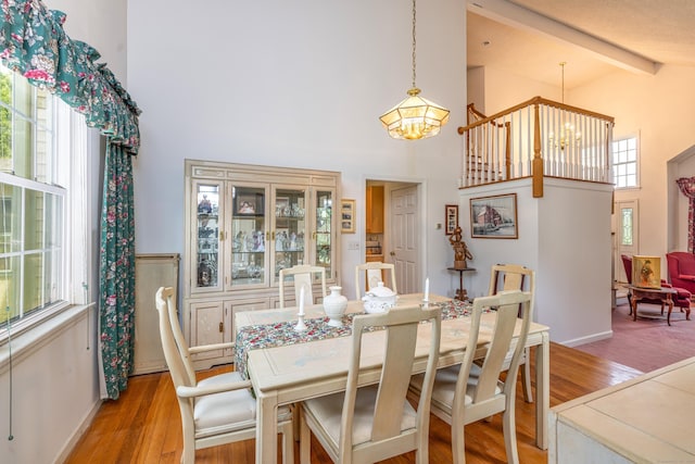 14 Fieldstone Dr, Mansfield, CT 06268 - dining space with a chandelier, high vaulted ceiling, light wood-style floors, and beam ceiling