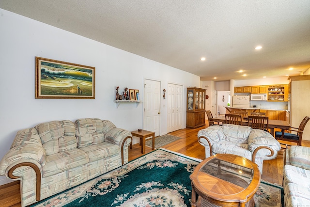 14 Fieldstone Dr, Mansfield, CT 06268 - living room with light wood-style floors and recessed lighting