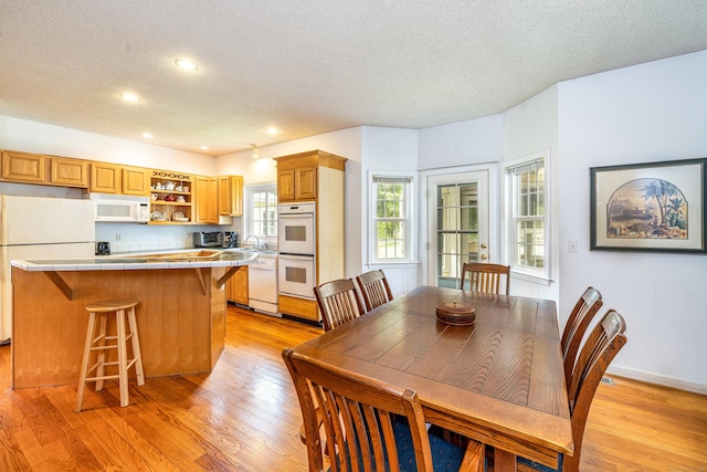 14 Fieldstone Dr, Mansfield, CT 06268 - dining area with a textured ceiling, light wood finished floors, and recessed lighting
