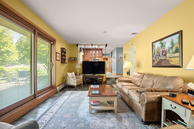 living room with visible vents and a baseboard radiator