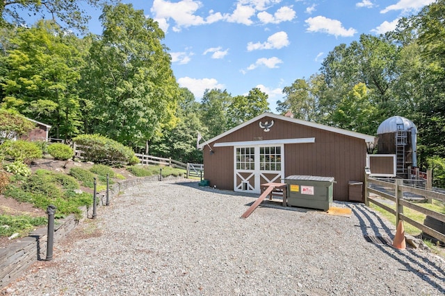 view of outbuilding featuring an outdoor structure and an exterior structure